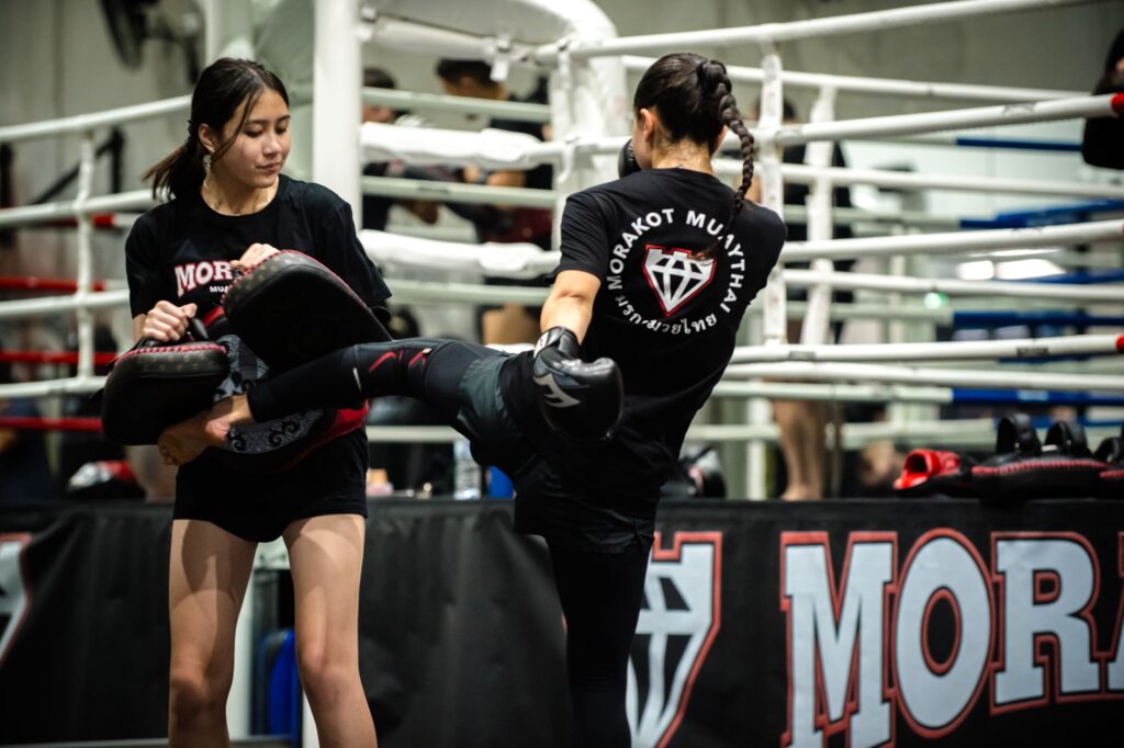 A student smashes the pads during a Muay Thai class at Morakot (Epping) in Melbourne.